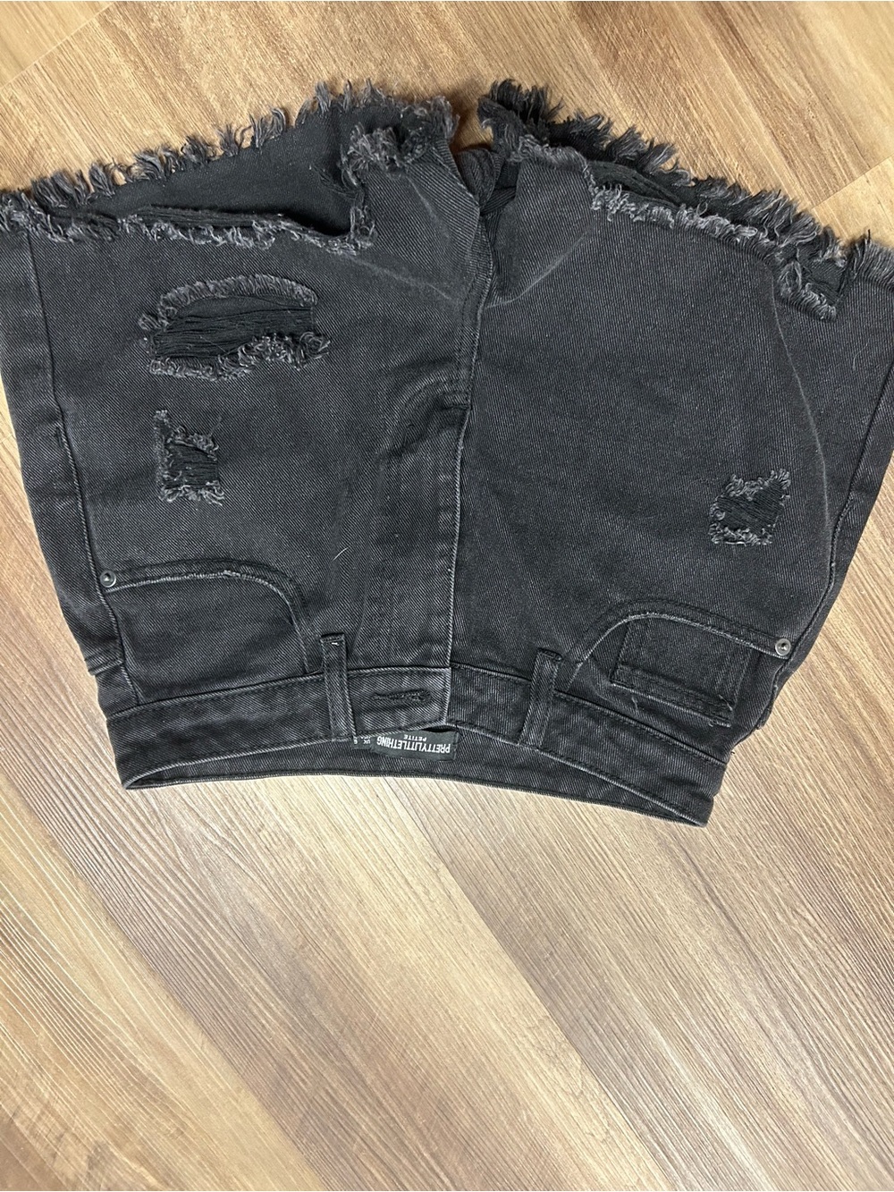 Black ripped jean shorts
